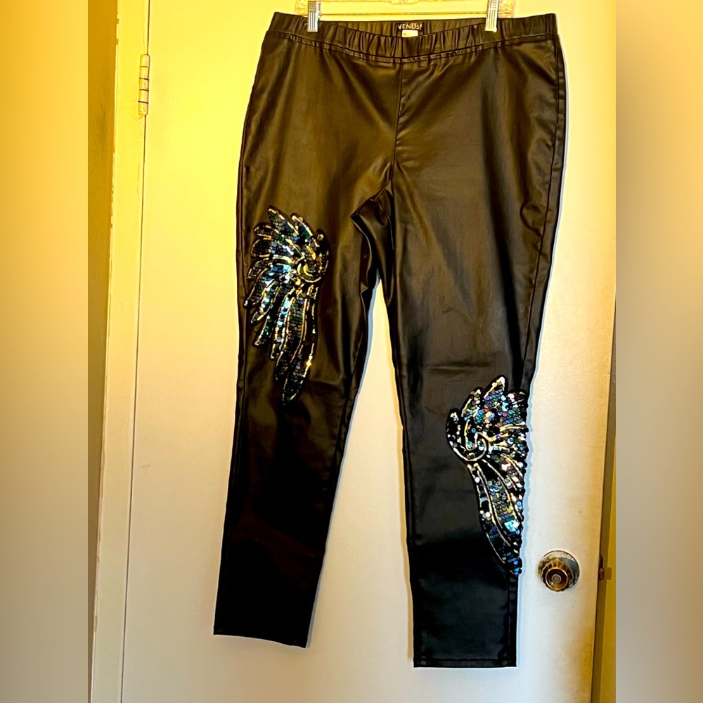 Black leatherette leggings with Angel Wings Jeweled details. Gently worn.